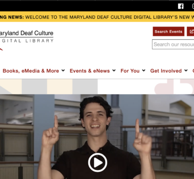 front page screenshot with menu, video still, and logo displayed for DCDL